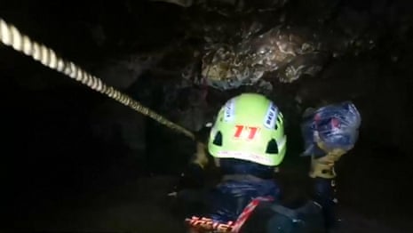 Headcam footage shows difficult conditions facing divers in Thai cave – video