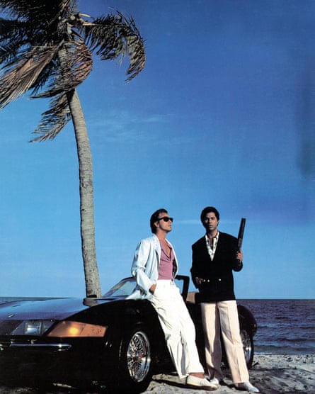 Miami Vice’s Crockett and Tubbs with their convertible on a beach
