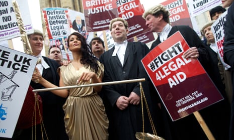 Lawyers protest against planned cuts to the legal aid budget in London on March 2014