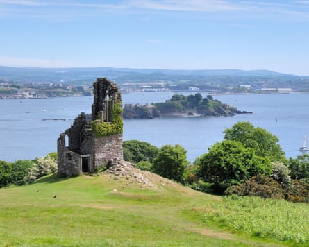 The ruined stone folly at Mount Edgcumbe Country Park sits on a fill overlooking the sea.