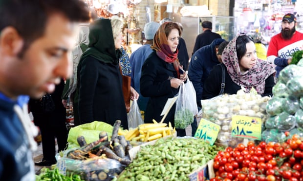 Iranians shop in a bazaar in Tehran as sanctions covering Iran’s shipping, financial and energy sectors –waived as part of 2015 nuclear deal – took effect.