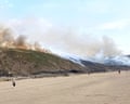 Summer weather Aug 14th 2022<br>A grass fire by Newgale Beach, Pembrokeshire, as a drought has been declared for parts of England following the driest summer for 50 years. Picture date: Sunday August 14, 2022. PA Photo.Parts of the UK are bracing for another day of sizzling temperatures ahead of three days of yellow weather warnings for thunderstorms. An amber weather warning for extreme heat is in place until 11.59pm on Sunday for large parts of the south, east, west, midlands and north of England as temperatures are predicted to rise to 32C. See PA story WEATHER Heat. Photo credit should read: Sam Russell/PA Wire