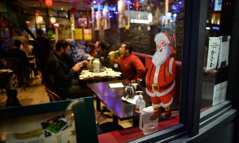 A Santa sticker in the window of a restaurant in London this week