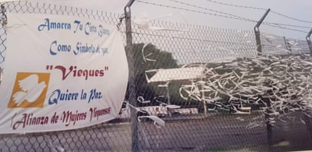 banner next to ribbons tied to fence