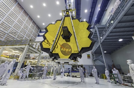 Technicians lift the mirror of the James Webb space telescope with a crane at the Goddard Space Flight Center in Maryland.