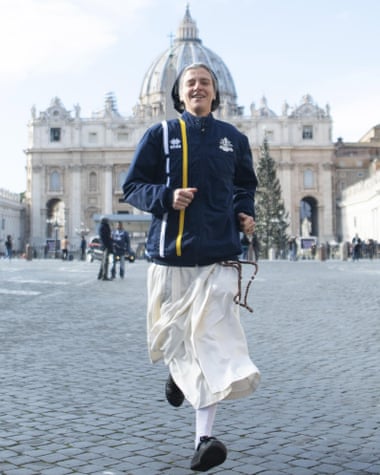 Nun Marie-Theo Manaudpose runs in front of St Peter’s basilica at the Vatican.