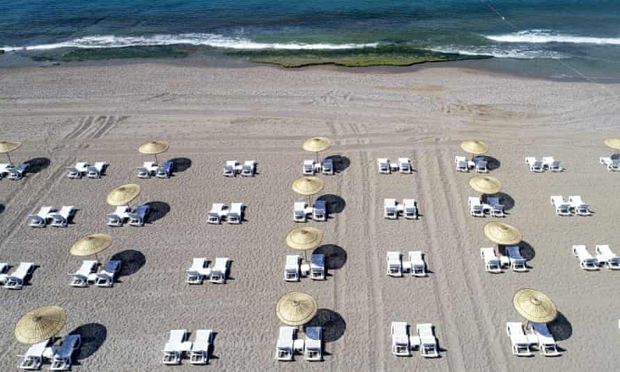 Empty sunbeds on beach