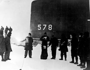 Wilkins is honoured a few months after his death in November 1958 by the spreading of his ashes in this ceremony conducted at the north pole by the crew of the USS Skate under Admiral James Calvert