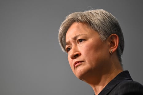 A woman with grey hair.
