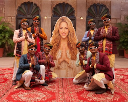 First of many mashups … Ismail Langa pose with a larger-than-life image of Shakira.