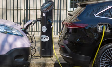 Cars being charged at an electric car charging point