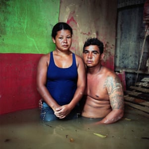 José Alcides dos Santos and Erenilce Lima e Silva in Taquari District, Rio Branco Brazil in their flooded home