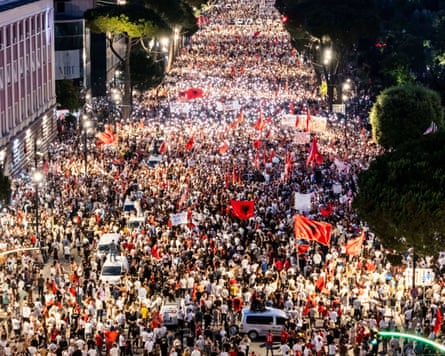 Thousands of protesters filling a city street