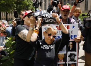 Pro and anti-Trump demonstrators clash outside the courthouse.