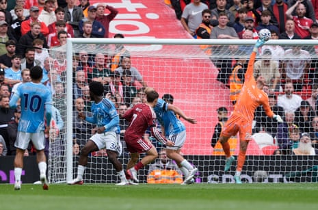 Liverpool's Florian Wirtz has a header saved by Nottingham Forest goalkeeper Matz Sels.