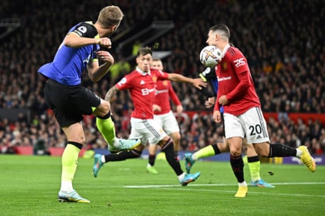 Tottenham Hotspur’s Harry Kane (left) shoots the ball and hits Manchester United’s Diogo Dalot.