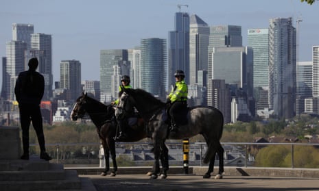 Police officers patrol Greenwich Park in London during lockdown.