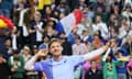 David Goffin cups his ear to the crowd after beating Giovanni Mpetshi Perricard in the first round of the men's singles tournament at the French Open on 28 May 2024
