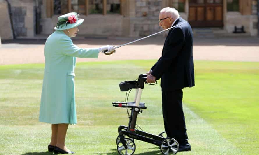 Captain Sir Tom Moore receives his knighthood from the Queen