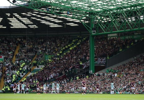 The Hearts fans cheer on their side.