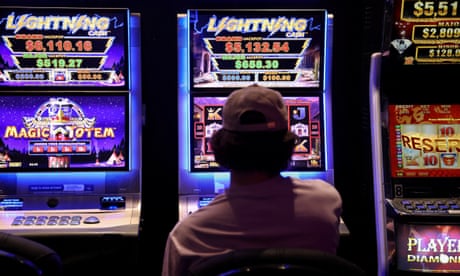 A person gambles on a poker machine