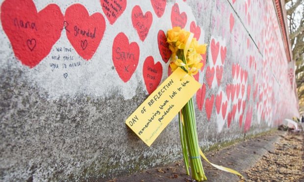 Flowers left at the National Covid-19 Memorial Wall in London on 23 March 2022.
