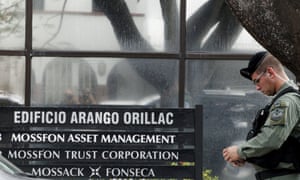 A police officer stands guard outside the Mossack Fonseca office in Panama City.