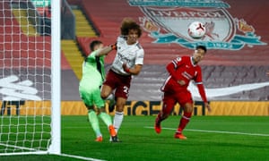 David Luiz heads the ball clear.