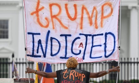 A woman celebrates Donald Trump's impeachment at the White House last month.