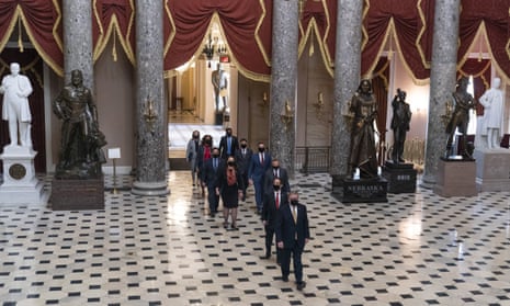 Timothy Blodgett, acting sergeant-at-arms, leads Congress members Jamie Raskin, David Cicilline, Diana DeGette, Joaquin Castro, Eric Swalwell, Ted Lieu, Stacey Plaskett, Madeline Dean and Joe Neguse to the Senate on 9 February. 