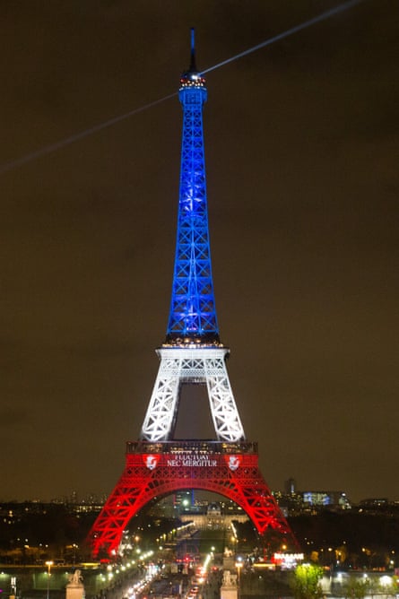 The Eiffel Tower is lit in the French tricolour to honour the victims of November atrocities.