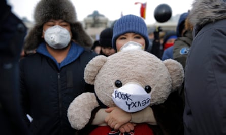 Protesters march in Ulaanbaatar on 28 January to demand government action to reduce air pollution.