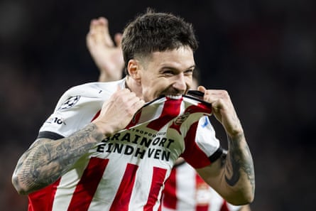 Dennis Man tries to take a bite out of his PSV Eindhoven shirt after making it 4-1 goal against Napoli.