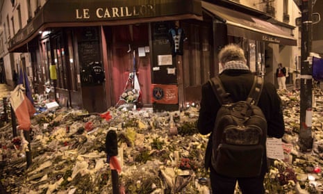 Flowers, candles and messages pile up outside Le Carillon restaurant in Paris, site of a terrorist attack on 13 November.