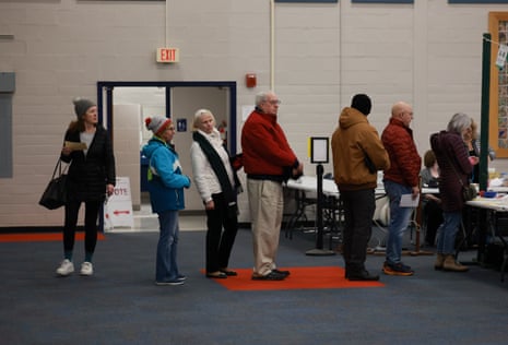 Voters check in to vote at a polling location setup at Winnacunnet High School in Hampton, New Hampshire.