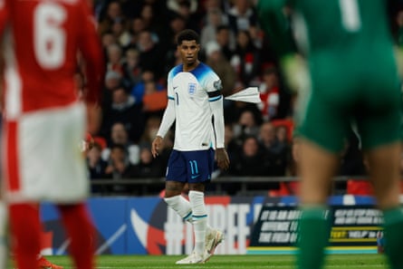 A paper plane flies near Marcus Rashford during England’s game with Malta