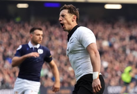 New Zealand's Cam Roigard celebrates scoring their first try against Scotland