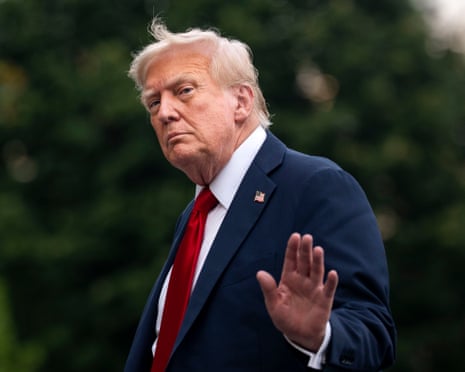 US President Donald Trump waves after exiting Marine One on the South Lawn of the White House in Washington DC.