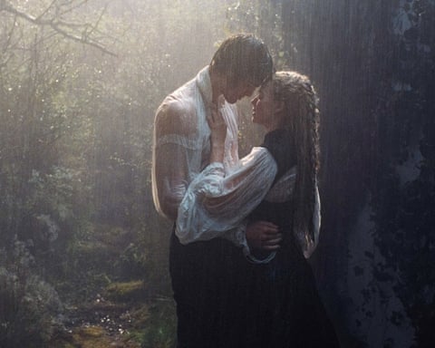 Jacob Elordi and Margot Robbie embracing in the rain