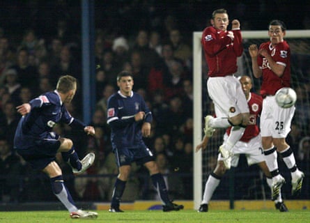 Southend’s Freddy Eastwood (left) takes a free kick and scores past Manchester United’s Wayne Rooney and David Jones (right) to score the only goal of the game during their English Carling Cup fourth round soccer match at Roots Hall in Southend in November 2006.