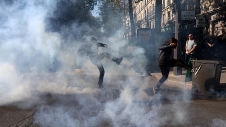 Police fire teargas at striking protesters in Paris – video