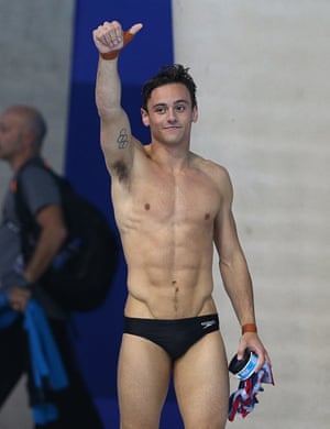 Tom Daley in Speedos giving a thumbs-up