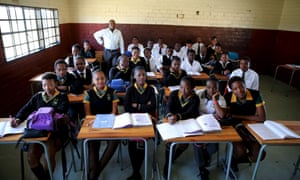Teacher Reginald Sikhwari with students at Sekano-Ntoane school