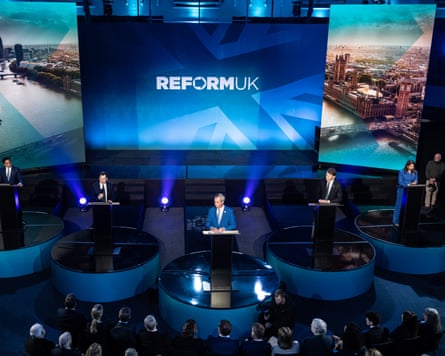 Wider shot of the five on stage