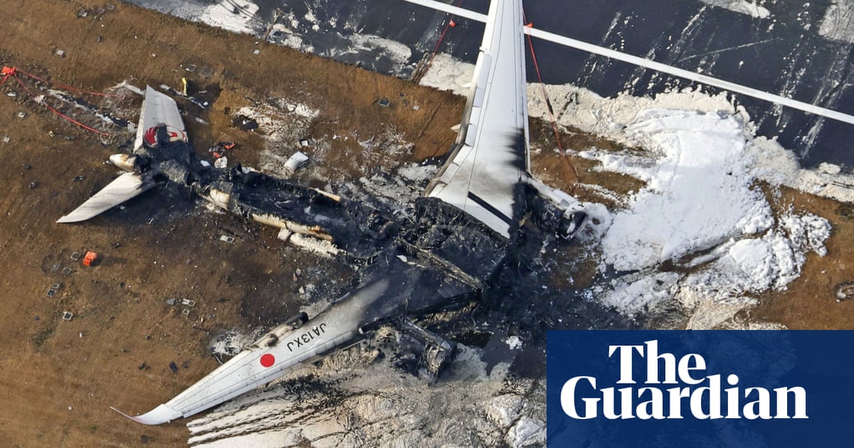 Passenger jet in fiery crash at Haneda airport was cleared to land, Japan Airlines says