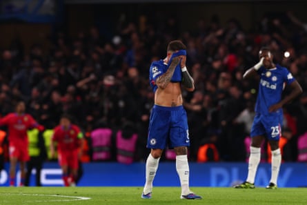 Enzo Fernández covers his face with his shirt after Bradley Barcola put Paris Saint-Germain 2-0 up in the second leg of Chelsea’s Champions League last-16 tie
