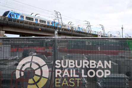 A train approaches Clayton Metro station passing construction work for the Clayton Suburban Rail Loop