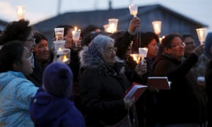 People take part in a candlelight vigil Attawapiskat.