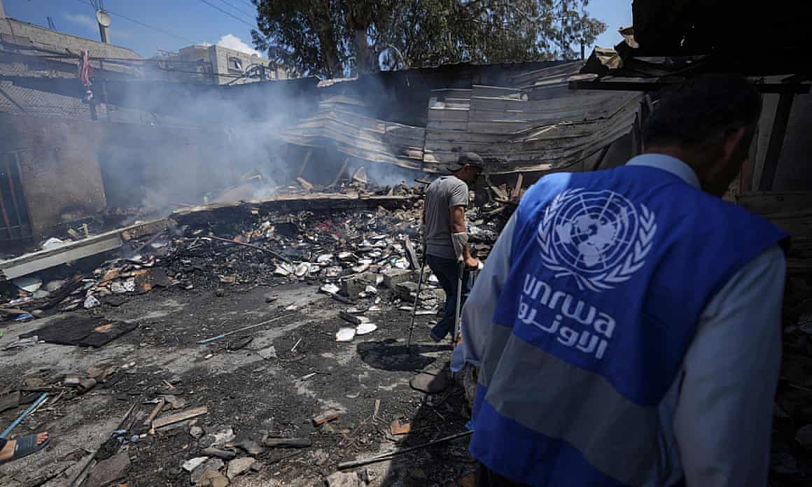 An Unrwa worker looks at the destruction after an Israeli strike on a school run by the UN agency in Gaza in May 2024.
