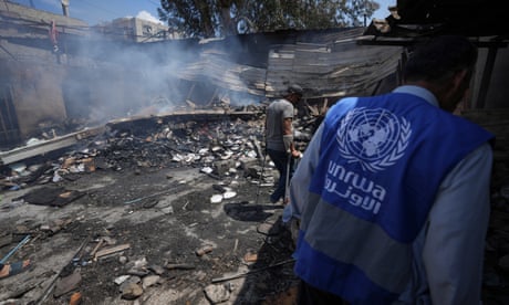 An Unrwa worker looks at the destruction after an Israeli strike on a school run by the UN agency in Gaza in May 2024.